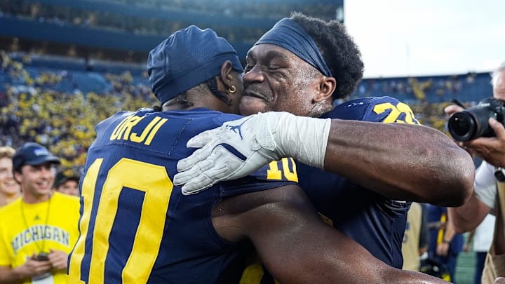 Michigan quarterback Alex Orji (10), left, hugs running back Kalel Mullings (20) after 27-24 win over USC at Michigan Stadium in Ann Arbor on Saturday, Sept. 21, 2024. Michigan quarterback Alex Orji (10), left, hugs running back Kalel Mullings (20) after 27-24 win over USC at Michigan Stadium in Ann Arbor on Saturday, Sept. 21, 2024.