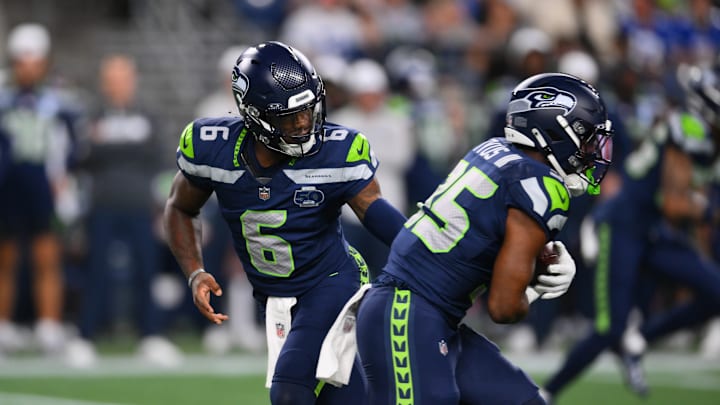 Aug 7, 2025; Seattle, Washington, USA; Seattle Seahawks quarterback Jalen Milroe (6) hands the ball off to running back Anthony Tyus III (35) during the second half at Lumen Field.