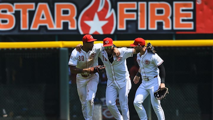 Aug 1, 2025; Cincinnati, Ohio, USA; Cincinnati Reds outfielder Will Benson (30), outfielder Noelvi Marte (16), and outfielder Jake Fraley (27) run off the field after the victory over the Atlanta Braves at Great American Ball Park. Mandatory Credit: Katie Stratman-Imagn Images