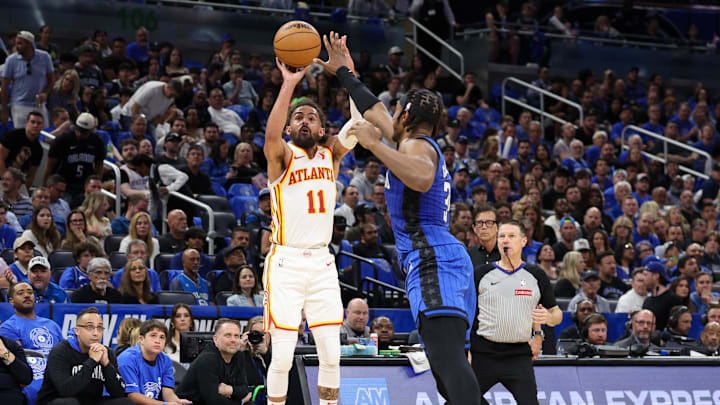 Apr 15, 2025; Orlando, Florida, USA; Atlanta Hawks guard Trae Young (11) shoots the ball over Orlando Magic center Wendell Carter Jr. (34) in the second quarter at Kia Center. Mandatory Credit: Nathan Ray Seebeck-Imagn Images Apr 15, 2025; Orlando, Florida, USA; Atlanta Hawks guard Trae Young (11) shoots the ball over Orlando Magic center Wendell Carter Jr. (34) in the second quarter at Kia Center. Mandatory Credit: Nathan Ray Seebeck-Imagn Images