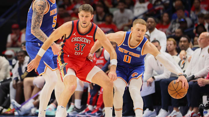 Oct 28, 2023; New Orleans, Louisiana, USA; New Orleans Pelicans forward Matt Ryan (37) tries to steal the ball from New York Knicks guard Donte DiVincenzo (0) in the third quarter at Smoothie King Center. Mandatory Credit: Matthew Dobbins-Imagn Images