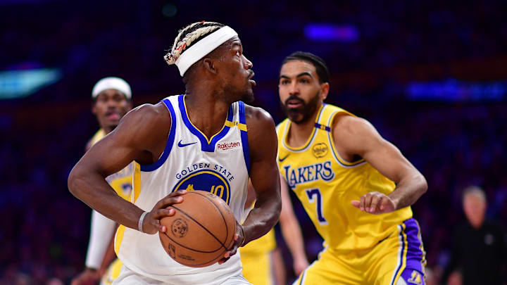 Apr 3, 2025; Los Angeles, California, USA; Golden State Warriors forward Jimmy Butler III (10) controls the ball against Los Angeles Lakers guard Gabe Vincent (7) during the second half at Crypto.com Arena. Mandatory Credit: Gary A. Vasquez-Imagn Images