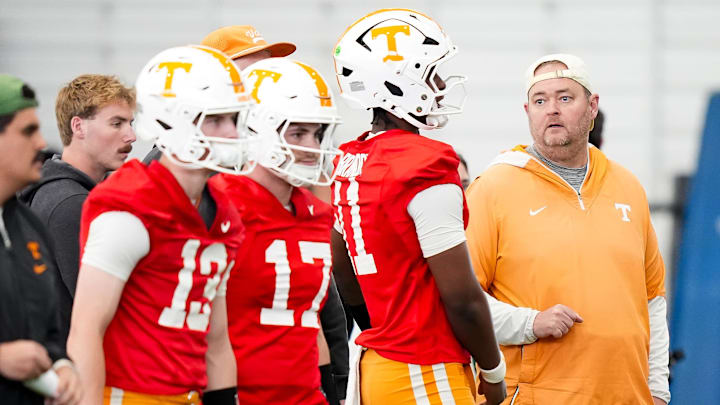 Tennessee coach Josh Heupel with the quarterbacks during the Vols' spring football practice in Knoxville on March 17, 2026. Tennessee coach Josh Heupel with the quarterbacks during the Vols' spring football practice in Knoxville on March 17, 2026.