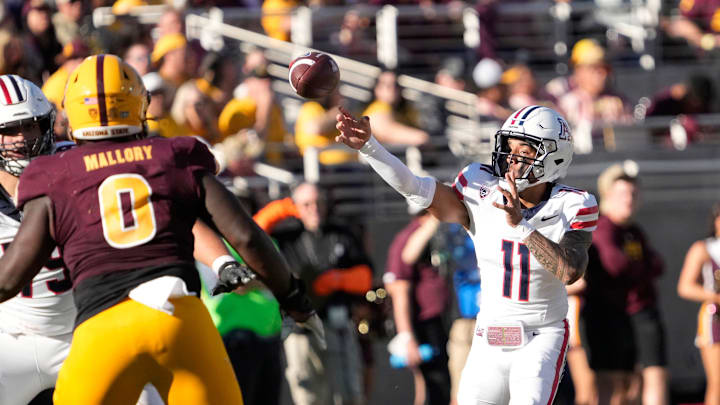 Nov 25, 2023; Tempe, Arizona, USA; Arizona quarterback Noah Fifita (11) throws a pass against Arizona State during the second quarter at Mountain America Stadium. Mandatory Credit: Michael Chow-Arizona Republic Nov 25, 2023; Tempe, Arizona, USA; Arizona quarterback Noah Fifita (11) throws a pass against Arizona State during the second quarter at Mountain America Stadium. Mandatory Credit: Michael Chow-Arizona Republic