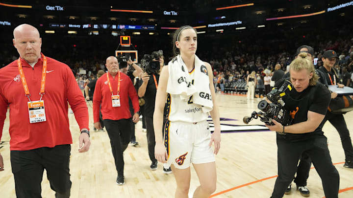 Jun 30, 2024; Phoenix, Ariz., U.S.; Indiana Fever guard Caitlin Clark (22) walks off the court after beating the Phoenix Mercury 88-82 at Footprint Center. Mandatory Credit: Michael Chow-Arizona Republic