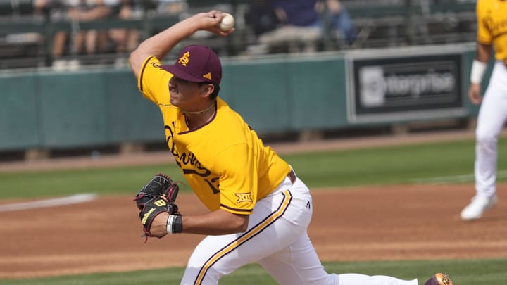 Arizona State pitcher Jaden Alba (12) delivers a pitch against Ohio State during the first inning at Phoenix Municipal Stadium on Sunday, Feb. 16, 2025.