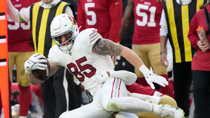 Dec 17, 2023; Glendale, Ariz, United States; Arizona Cardinals tight end Trey McBride (85) is tackled by San Francisco 49ers cornerback Deommodore Lenoir (2) during the third quarter at State Farm Stadium. Mandatory Credit: Michael Chow-Arizona Republic Dec 17, 2023; Glendale, Ariz, United States; Arizona Cardinals tight end Trey McBride (85) is tackled by San Francisco 49ers cornerback Deommodore Lenoir (2) during the third quarter at State Farm Stadium. Mandatory Credit: Michael Chow-Arizona Republic