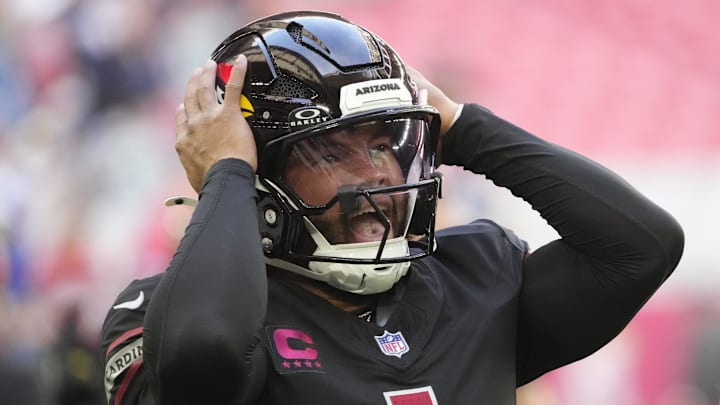 Arizona Cardinals quarterback Kyler Murray adjusts his helmet before playing against the Seattle Seahawks at State Farm Stadium in Glendale on Dec. 8, 2024.