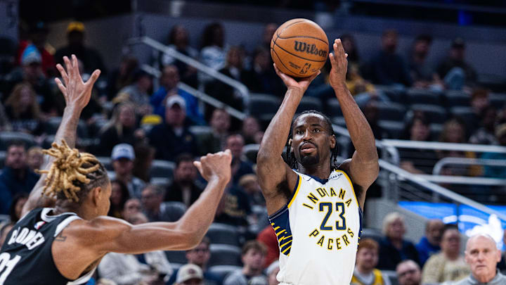 Nov 5, 2025; Indianapolis, Indiana, USA; Indiana Pacers guard/forward Aaron Nesmith (23) shoots the ball while Brooklyn Nets forward/center Noah Clowney (21) defends in the first half at Gainbridge Fieldhouse. Mandatory Credit: Trevor Ruszkowski-Imagn Images Nov 5, 2025; Indianapolis, Indiana, USA; Indiana Pacers guard/forward Aaron Nesmith (23) shoots the ball while Brooklyn Nets forward/center Noah Clowney (21) defends in the first half at Gainbridge Fieldhouse. Mandatory Credit: Trevor Ruszkowski-Imagn Images