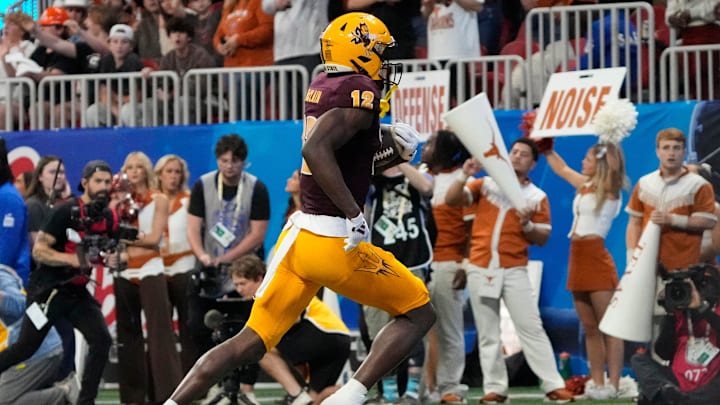 Arizona State wide receiver Malik McClain (12) scores a touchdown against Texas during the fourth quarter in the Chick-fil-A Peach Bowl in Atlanta on Wednesday, Jan. 1, 2025.
