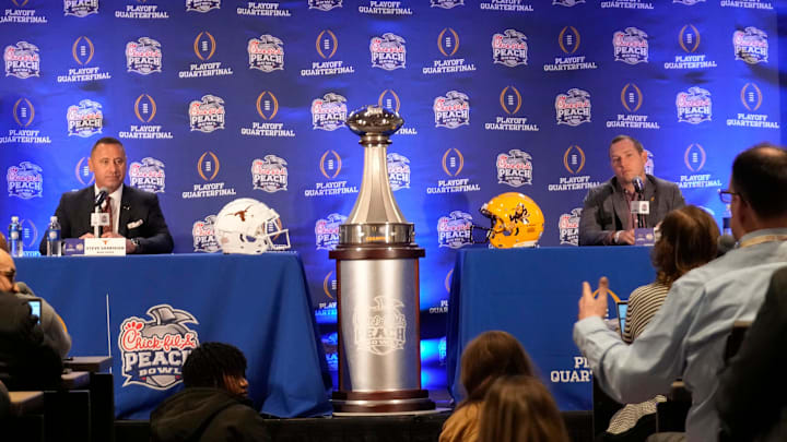 Texas head coach Steve Sarkisian and Arizona State head coach Kenny Dillingham hold a joint news conference before facing off in the Chick-fil-A Peach Bowl. Texas head coach Steve Sarkisian and Arizona State head coach Kenny Dillingham hold a joint news conference before facing off in the Chick-fil-A Peach Bowl.