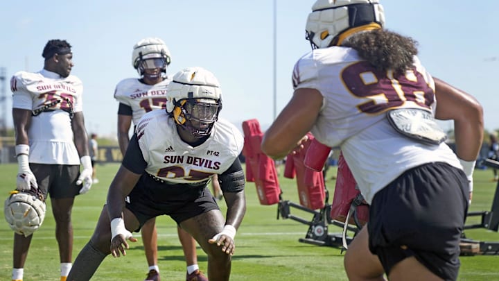 Arizona State defensive linemen MyKeil Gardner (93), left, and Jacob Rich Kongaika (98) train during football practice at Kajikawa practice fields in Tempe on Aug 1, 2025.