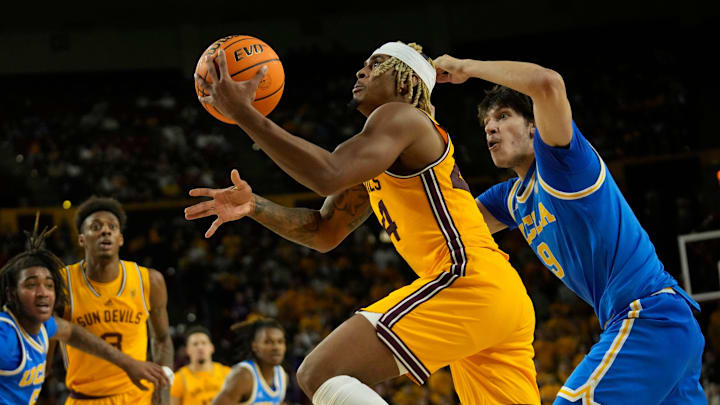 Arizona State Sun Devils guard Adam Miller (44) lays the ball in past UCLA Bruins forward Berke Buyuktuncel (9) during the second half at Desert Financial Arena in Tempe on Jan. 17, 2024.
