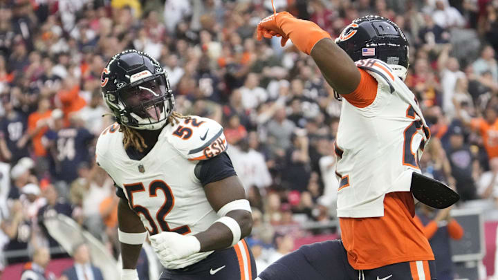 Darrell Taylor celebrates with Elijah Hicks following a turnover against the Cardinals. Darrell Taylor celebrates with Elijah Hicks following a turnover against the Cardinals.