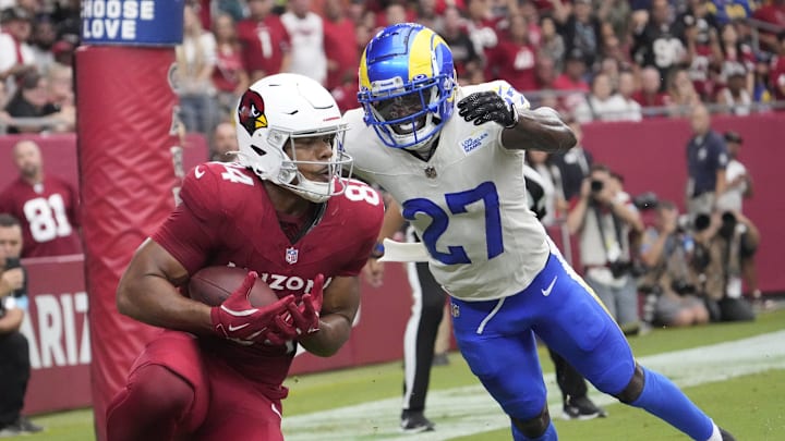 Arizona Cardinals tight end Elijah Higgins (84) catches a touchdown against Los Angeles Rams cornerback Tre'Davious White (27) during the second quarter at State Farm Stadium on Sept. 15, 2024.