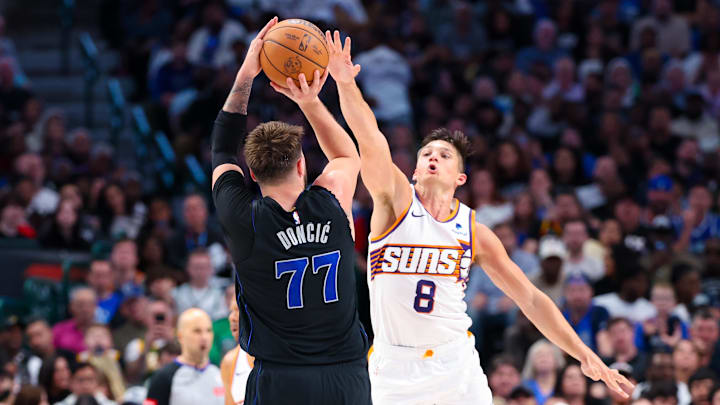Feb 22, 2024; Dallas, Texas, USA; Dallas Mavericks guard Luka Doncic (77) shoots over Phoenix Suns guard Grayson Allen (8) during the second half at American Airlines Center. Mandatory Credit: Kevin Jairaj-Imagn Images Feb 22, 2024; Dallas, Texas, USA; Dallas Mavericks guard Luka Doncic (77) shoots over Phoenix Suns guard Grayson Allen (8) during the second half at American Airlines Center. Mandatory Credit: Kevin Jairaj-Imagn Images