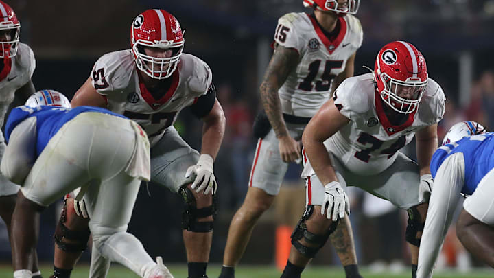 Nov 9, 2024; Oxford, Mississippi, USA; Georgia Bulldogs offensive lineman Monroe Freeling (57) and offensive lineman Drew Bobo (74) wait for the snap against the Mississippi Rebels during the second half  at Vaught-Hemingway Stadium. Mandatory Credit: Petre Thomas-Imagn Images