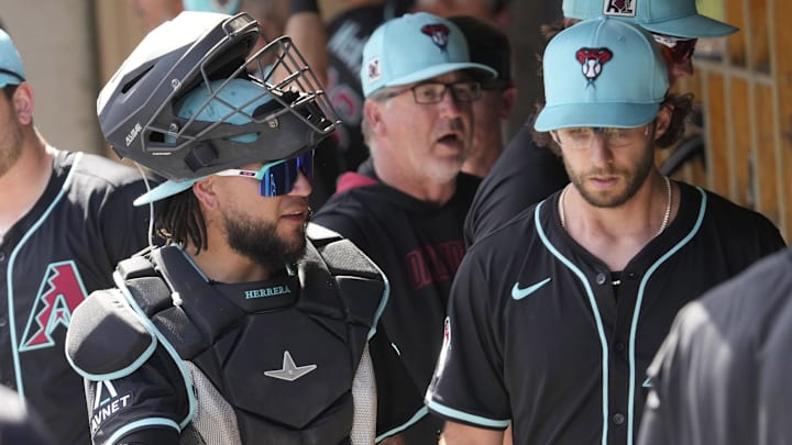 Arizona Diamondbacks catcher Jose Herrera talks with pitcher Zac Gallen (23) during a spring training game against the Cleveland Guardians at Salt River Fields on Feb. 24, 2025.