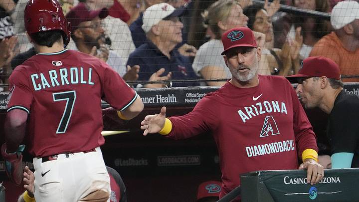 Arizona Diamondbacks manager Torey Lovullo (17) congratulates Corbin Carroll (7) after scoring against the Boston Red Sox during the sixth inning at Chase Field on Sept. 7, 2025.