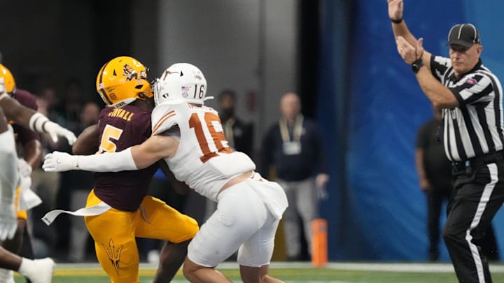 Arizona State wide receiver Melquan Stovall (5) is tackled by Texas defensive back Michael Taaffe (16) after a catch during the fourth quarter in the Chick-fil-A Peach Bowl in Atlanta on Jan. 1, 2025. The play was reviewed for targeting but was not called.