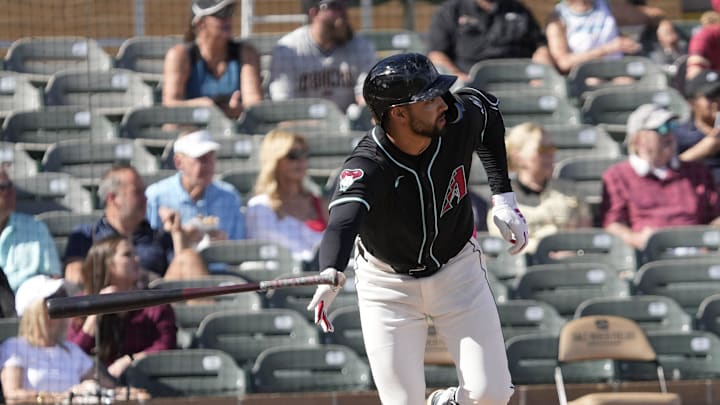 Arizona Diamondbacks shortstop Jordan Lawlar (10) tosses his bat while batting against the Cleveland Guardians during a spring training game at Salt River Fields on Feb. 24, 2025.