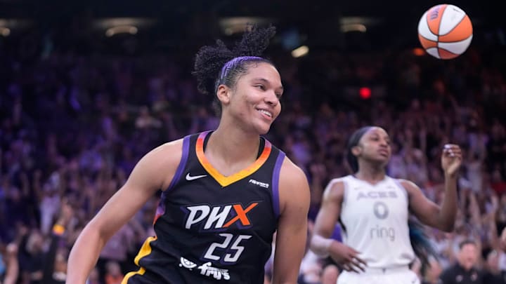 Phoenix Mercury forward Alyssa Thomas (25) smiles after a layup against Las Vegas Aces guard Jackie Young (0) during the fourth quarter at PHX Arena Jun 29, 2025.