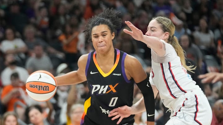 Phoenix Mercury forward Satou Sabally (0) drives against Washington Mystics forward Emily Engstler (21) during the fourth quarter at PHX Arena on May 25, 2025.