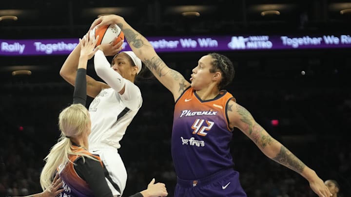 Phoenix Mercury center Brittney Griner (42) blocks a shot by Las Vegas Aces center A'ja Wilson (22) during the second quarter at Footprint Center on Sept. 1, 2024, in Phoenix.