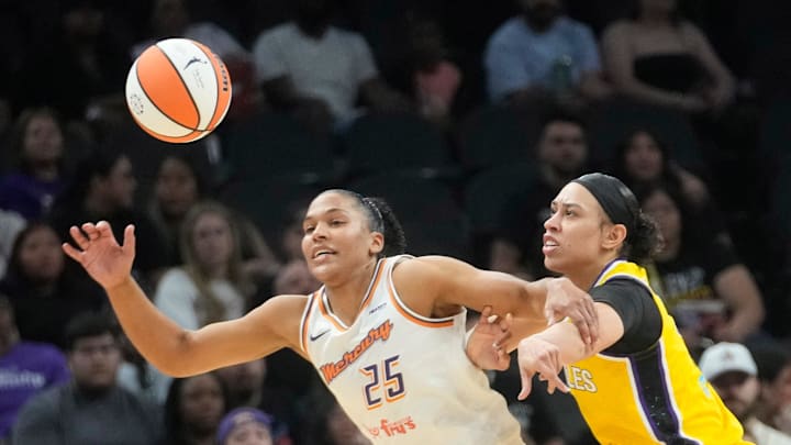 Phoenix Mercury forward Alyssa Thomas (25) is defended by Los Angeles Sparks forward Dearica Hamby (5) during the second quarter at PHX Arena in Phoenix, on May 21, 2025. Phoenix Mercury forward Alyssa Thomas (25) is defended by Los Angeles Sparks forward Dearica Hamby (5) during the second quarter at PHX Arena in Phoenix, on May 21, 2025.
