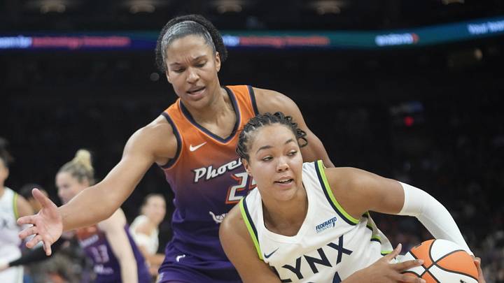 Phoenix Mercury forward Alyssa Thomas (25) defends against Minnesota Lynx forward Napheesa Collier (24) during the third quarter at PHX Arena on July 9, 2025.