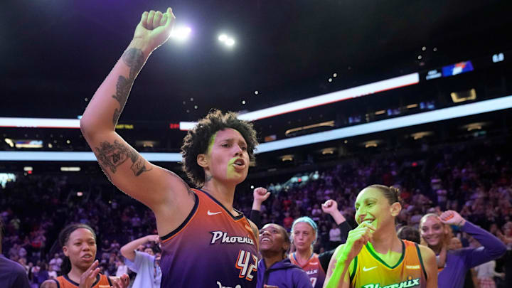 Phoenix Mercury center Brittney Griner (42) and guard Diana Taurasi (3) celebrate after beating the Seattle Storm 87-78 at Footprint Center in Phoenix on Sunday, June 16, 2024.