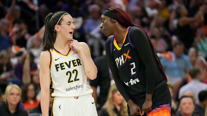 Indiana Fever guard Caitlin Clark (22) talks with Phoenix Mercury guard Kahleah Copper (2) during the first quarter at Footprint Center on June 30, 2024, in Phoenix.