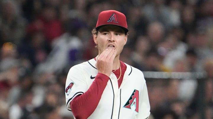 Arizona Diamondbacks starting pitcher Ryne Nelson (19) licks his fingers before pitching against the Arizona Diamondbacks starting pitcher Ryne Nelson (19) licks his fingers before pitching against the
