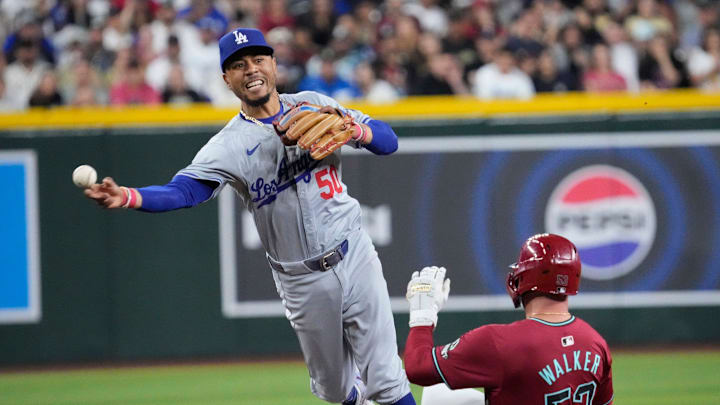 Los Angeles Dodgers shortstop Mookie Betts (50) throws to first.