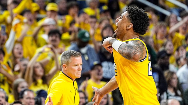 Michigan forward Yaxel Lendeborg (23) celebrates a play as he walks off the court for substitution during the second half against Michigan State at Crisler Center in Ann Arbor on Sunday, March 8, 2026. Michigan forward Yaxel Lendeborg (23) celebrates a play as he walks off the court for substitution during the second half against Michigan State at Crisler Center in Ann Arbor on Sunday, March 8, 2026.