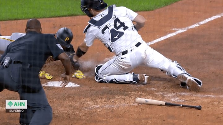 Pham slides into home as Rogers works to get the tag down