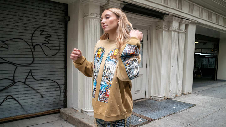 UConn women's basketball star Paige Bueckers leaves the Who Decides War show during New York Fashion Week. 