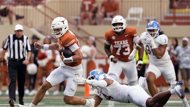 Sep 6, 2025; Austin, Texas, USA; Texas Longhorns quarterback Arch Manning (16) is tackled by San Jose State Spartans after keeping the ball for yardage during the first half at Darrell K Royal-Texas Memorial Stadium. Mandatory Credit: Scott Wachter-Imagn Images Sep 6, 2025; Austin, Texas, USA; Texas Longhorns quarterback Arch Manning (16) is tackled by San Jose State Spartans after keeping the ball for yardage during the first half at Darrell K Royal-Texas Memorial Stadium. Mandatory Credit: Scott Wachter-Imagn Images