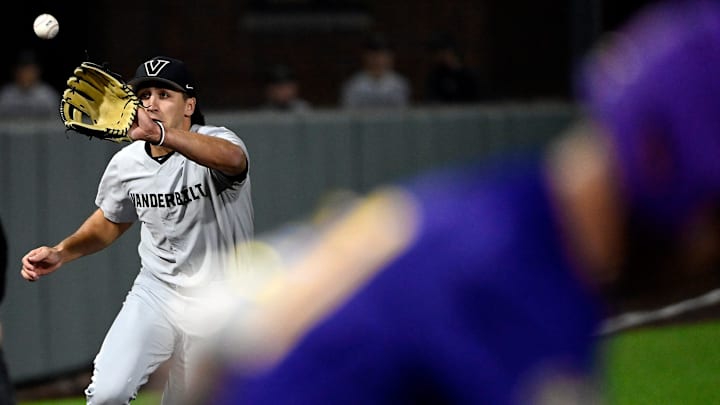 Vanderbilt third baseman Chris Maldonado (8) throws out Tennessee Tech base runner Mack Whitcomb at first base in the fifth inning of an NCAA college baseball game at Hawkins Field Tuesday, Feb. 25, 2025, in Nashville, Tenn.