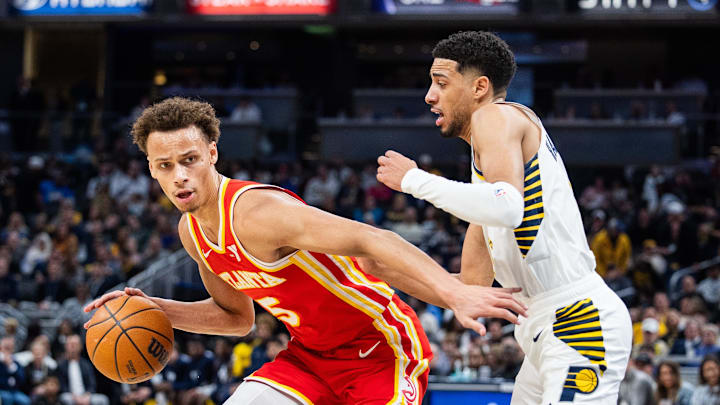 Feb 1, 2025; Indianapolis, Indiana, USA; Atlanta Hawks guard Dyson Daniels (5) dribbles the ball against Indiana Pacers guard Tyrese Haliburton (0) in the first half at Gainbridge Fieldhouse. Mandatory Credit: Trevor Ruszkowski-Imagn Images Feb 1, 2025; Indianapolis, Indiana, USA; Atlanta Hawks guard Dyson Daniels (5) dribbles the ball against Indiana Pacers guard Tyrese Haliburton (0) in the first half at Gainbridge Fieldhouse. Mandatory Credit: Trevor Ruszkowski-Imagn Images