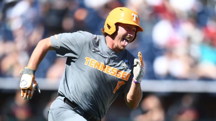 Tennessee's Jared Dickey (17) celebrating on his way to second base during the NCAA Baseball College World Series in Omaha, Nebraska, on Monday, June 19, 2023.