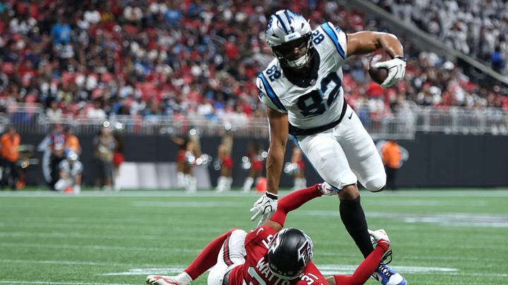 Carolina Panthers tight end Tommy Tremble (82) breaks a tackle from Atlanta Falcons safety Xavier Watts Carolina Panthers tight end Tommy Tremble (82) breaks a tackle from Atlanta Falcons safety Xavier Watts