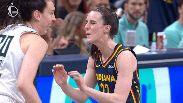Clark and Stewart react after Clark drains a three-pointer for the Fever against the Liberty