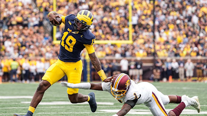 Michigan quarterback Bryce Underwood (19) runs against Central Michigan Central Michigan linebacker Dakota Cochran (1) during the first half at Michigan Stadium in Ann Arbor on Saturday, Sept. 13, 2025.