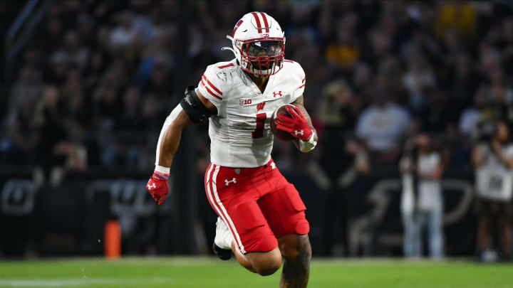 Sep 22, 2023; West Lafayette, Indiana, USA; Wisconsin Badgers running back Chez Mellusi (1) runs the ball during the first half at Ross-Ade Stadium. Mandatory Credit: Robert Goddin-USA TODAY Sports Sep 22, 2023; West Lafayette, Indiana, USA; Wisconsin Badgers running back Chez Mellusi (1) runs the ball during the first half at Ross-Ade Stadium. Mandatory Credit: Robert Goddin-USA TODAY Sports