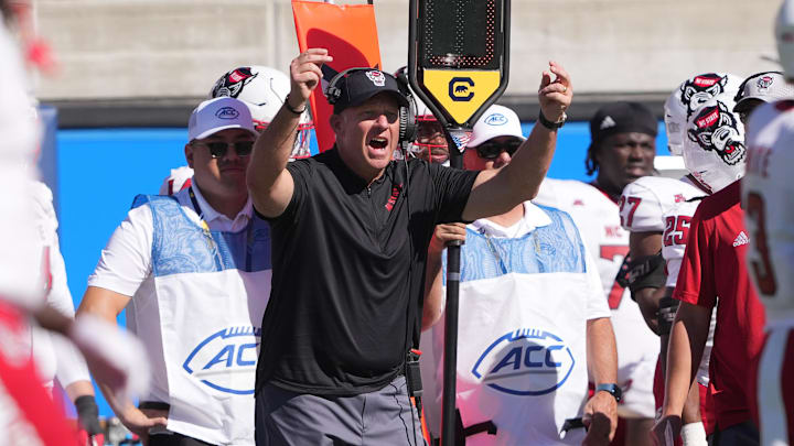Oct 19, 2024; Berkeley, California, USA; North Carolina State Wolfpack head coach Dave Doeren (center) yells during the second quarter against the California Golden Bears at California Memorial Stadium. Mandatory Credit: Darren Yamashita-Imagn Images Oct 19, 2024; Berkeley, California, USA; North Carolina State Wolfpack head coach Dave Doeren (center) yells during the second quarter against the California Golden Bears at California Memorial Stadium. Mandatory Credit: Darren Yamashita-Imagn Images