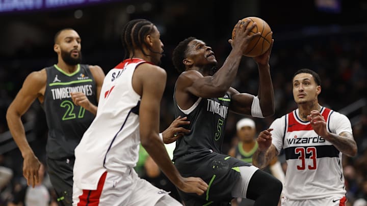 Jan 13, 2025; Washington, District of Columbia, USA; Minnesota Timberwolves guard Anthony Edwards (5) drives to the basket as Washington Wizards forward Alexandre Sarr (20) and Wizards forward Kyle Kuzma (33) defend in the fourth quarter at Capital One Arena. Mandatory Credit: Geoff Burke-Imagn Images Jan 13, 2025; Washington, District of Columbia, USA; Minnesota Timberwolves guard Anthony Edwards (5) drives to the basket as Washington Wizards forward Alexandre Sarr (20) and Wizards forward Kyle Kuzma (33) defend in the fourth quarter at Capital One Arena. Mandatory Credit: Geoff Burke-Imagn Images