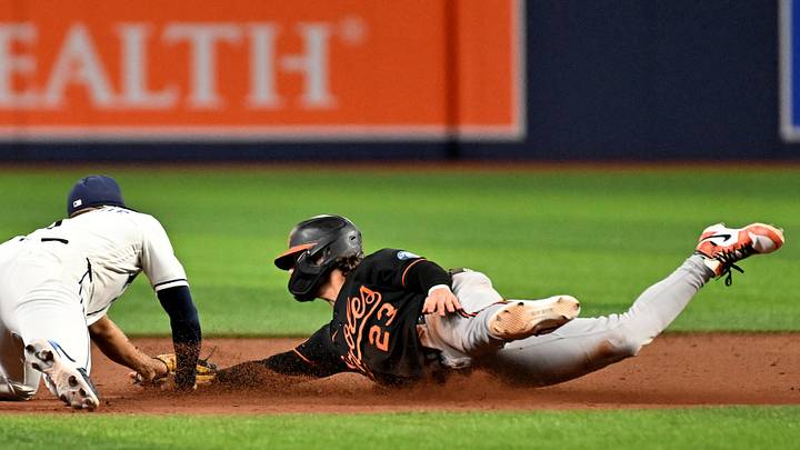 May 19, 2026; St. Petersburg, Florida, USA;  Tampa Bay Rays second baseman Richie Palacios (1) attempts to tag out pinch runner Blaze Alexander (23) in the eighth inning at Tropicana Field. Mandatory Credit: Jonathan Dyer-Imagn Images