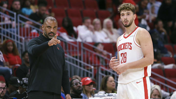 Oct 6, 2025; Houston, Texas, USA; Houston Rockets Head Coach Ime Udoka and center Alperen Sengun (28) react during the game against the Atlanta Hawks at Toyota Center. Mandatory Credit: Troy Taormina-Imagn Images