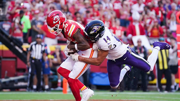 Sep 28, 2025; Kansas City, Missouri, USA; Kansas City Chiefs wide receiver Tyquan Thornton (80) scores a touchdown  as Baltimore Ravens safety Kyle Hamilton (14) defends during the third quarter at GEHA Field at Arrowhead Stadium. Mandatory Credit: Denny Medley-Imagn Images